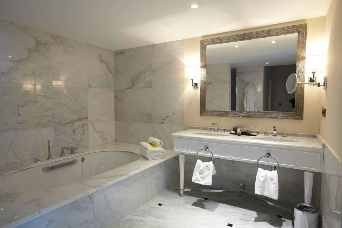 presidential suite | bathroom | designer toiletries, hair dryer, bathrobes, slippers