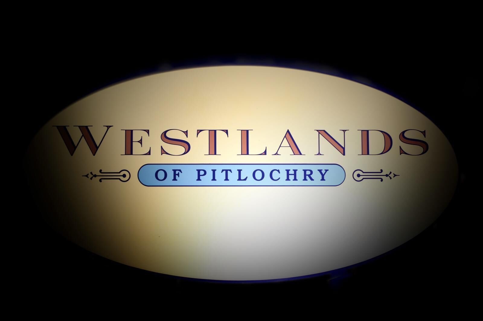 A logo with the text "WESTLANDS OF PITLOCHRY".