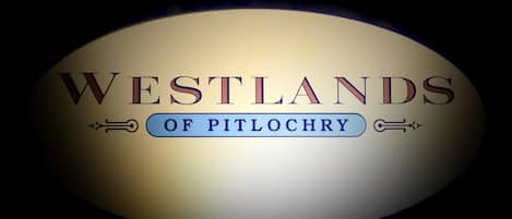 A logo with the text "WESTLANDS OF PITLOCHRY".