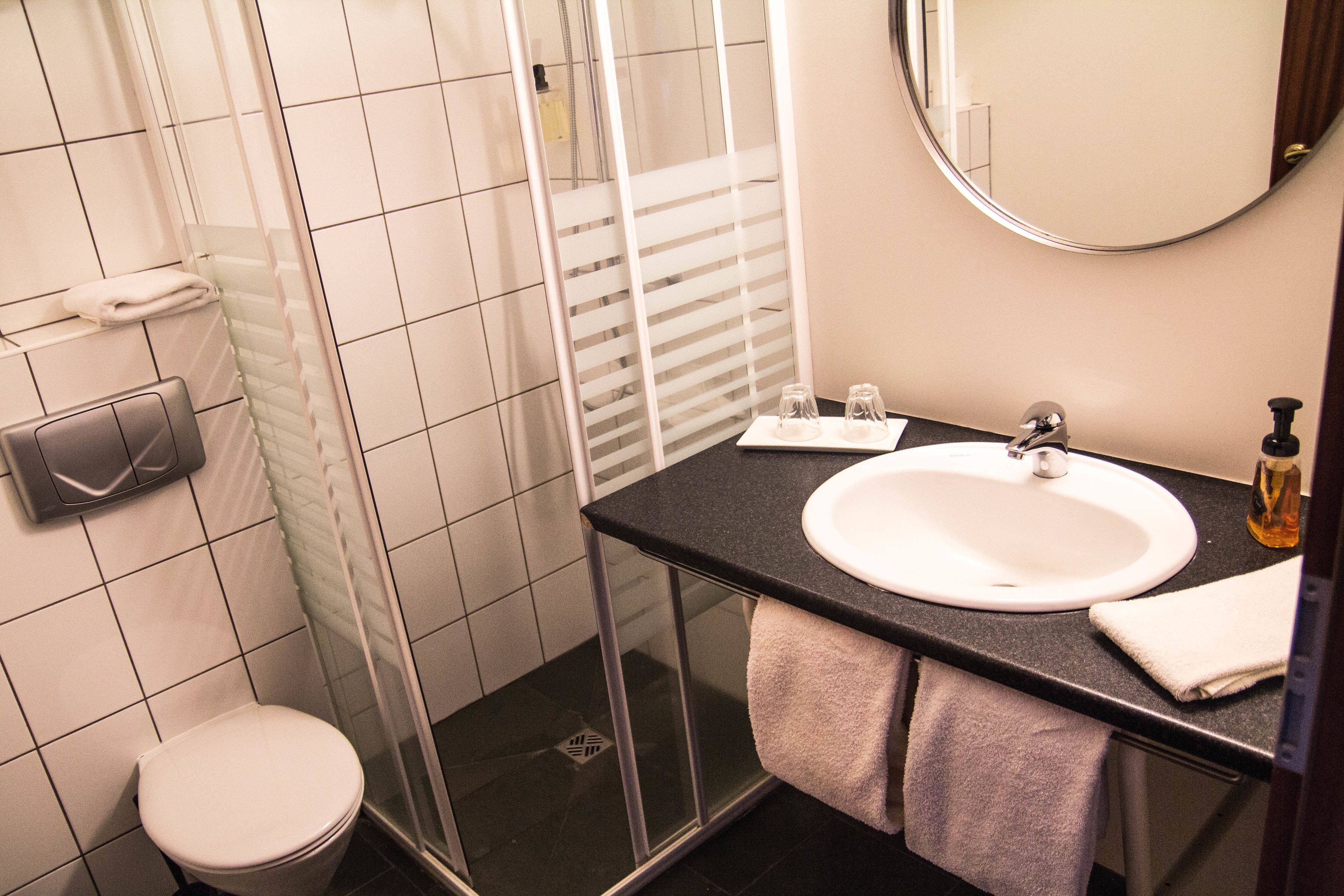 shower, hair dryer, heated floors, towels