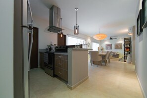 Deluxe Condo, 2 Bedrooms, Terrace, Pool View | Private kitchen | Full-size fridge, microwave, stovetop, coffee/tea maker