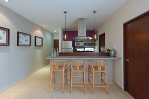 Deluxe Condo, 2 Bedrooms, Terrace, Pool View | Private kitchen | Full-size fridge, microwave, stovetop, coffee/tea maker