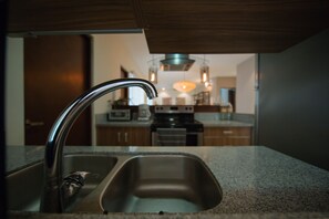 Deluxe Condo, 2 Bedrooms, Terrace, Pool View | Private kitchen | Full-size fridge, microwave, stovetop, coffee/tea maker - Amazing 2BR condo surrounded by nature by Happy Address (Tulum)