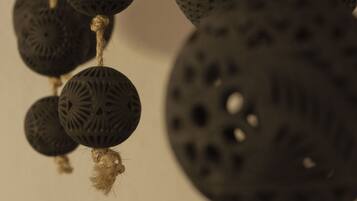 A close-up of a decorative object with a textured surface and a rope detail.