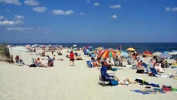 On the beach, white sand, sun-loungers