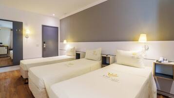 Standard Triple Room | Minibar, desk, free WiFi, bed sheets