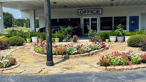 An office building with a sign reading "OFFICE" above the entrance. - Sallisaw Inn (Sallisaw)