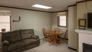 Lodge Suite, 2 Queen Beds | Living area | TV