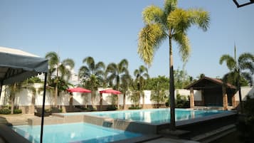Outdoor pool, pool umbrellas, sun loungers