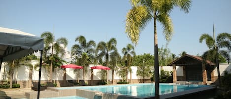 Outdoor pool, pool umbrellas, sun loungers