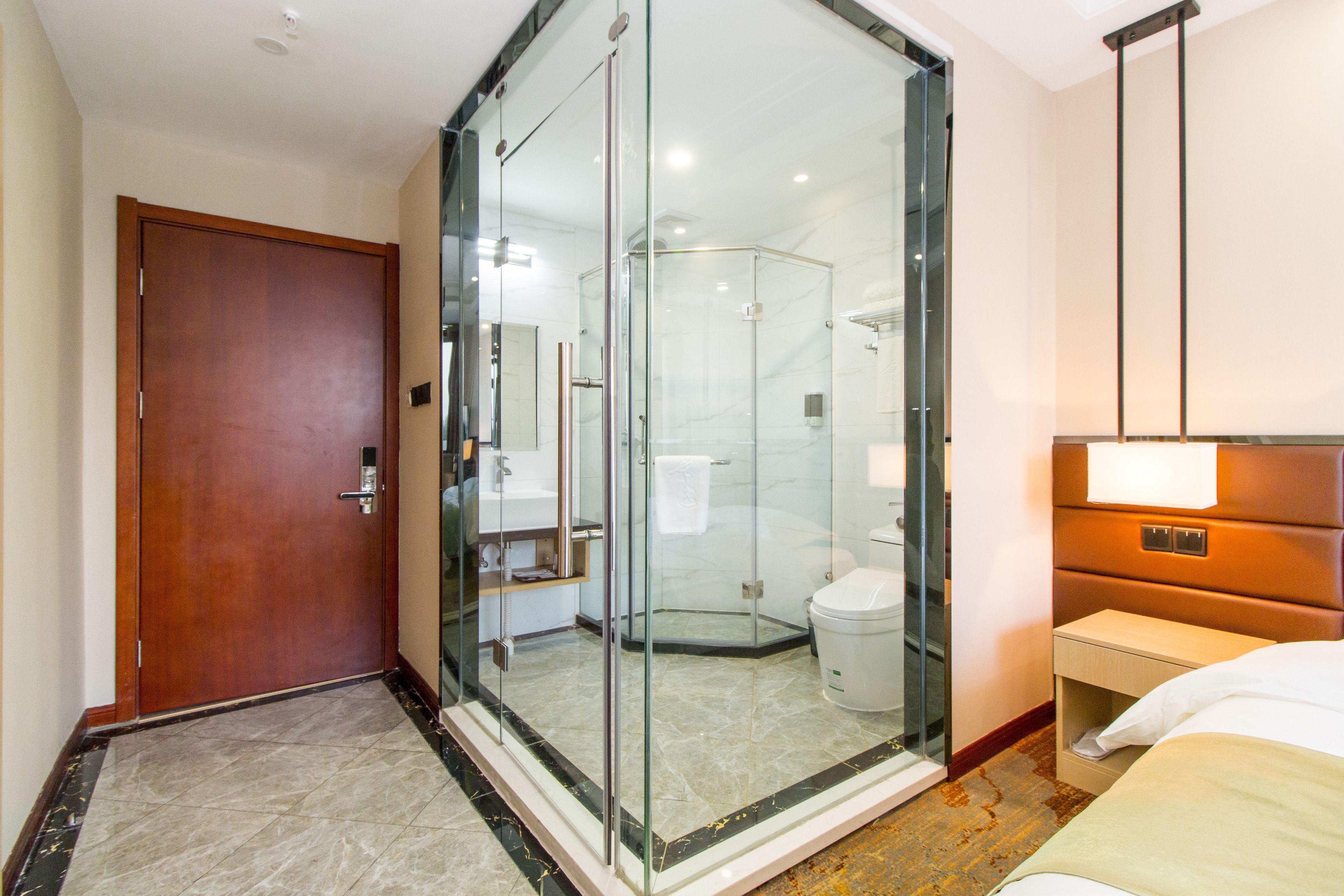 deluxe king room  | bathroom | shower, free toiletries, hair dryer, slippers