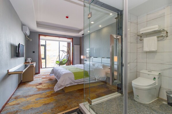 A modern hotel room with a bed, a desk, a shower, and a toilet. - Ease Cloud Hotel (Beijing)