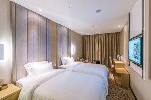 Chambre Deluxe avec lits jumeaux | Minibar, bureau, rideaux occultants, Wi-Fi gratuit