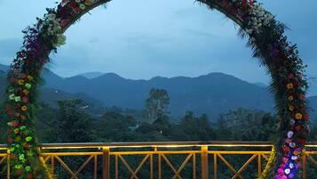 Relax in this serene outdoor seating area with a beautiful view of the distant mountains.