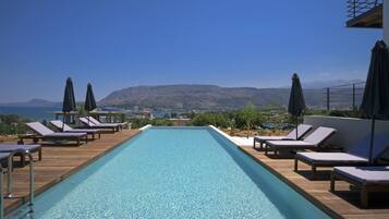 Outdoor pool, pool umbrellas, pool loungers