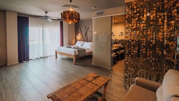 Junior Suite, Terrace, Sea View | Minibar, in-room safe, desk, laptop workspace