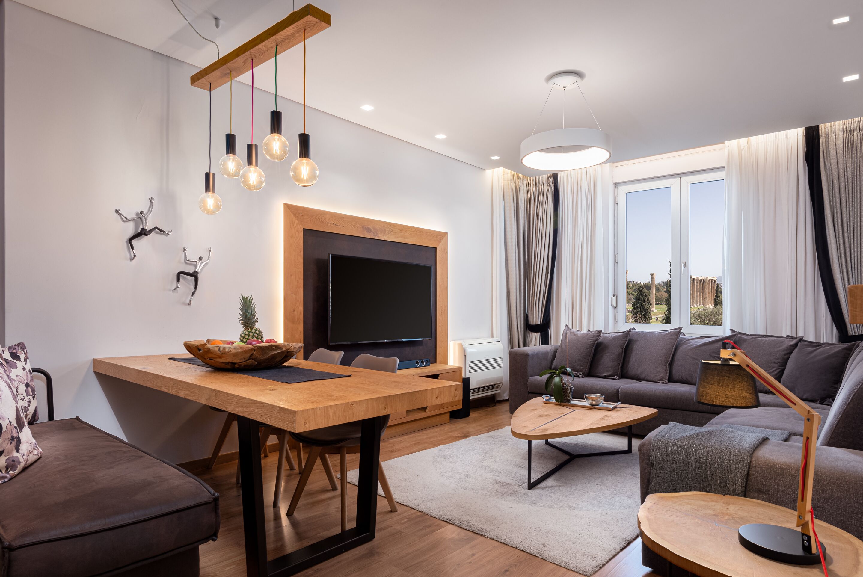 Acropolis Grand Residence | Living area | 50-inch Smart TV with cable channels, TV, Netflix