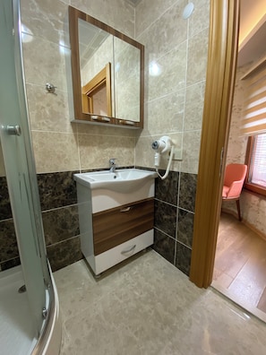 Shower, free toiletries, hair dryer, bathrobes