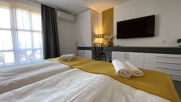 Luxe beddengoed, een minibar, een kluis op de kamer