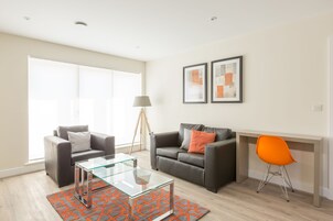 Luxury Apartment, 1 Double Bed, City View | Living room | 55-inch Smart TV with digital channels, Netflix, streaming services