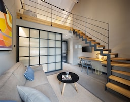 Deluxe Room, 1 King Bed with Sofa bed, Mezzanine | Living area