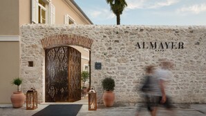 A stone wall with the name "ALMAYER" and a decorative entrance. - Almayer Art & Heritage Adults Only Hotel & Dépendance Rooms (Zadar)