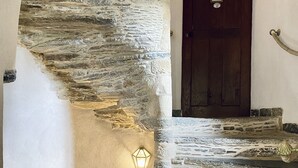 A stone staircase with a wooden door at the top. - Château de la Roque (Thereval)