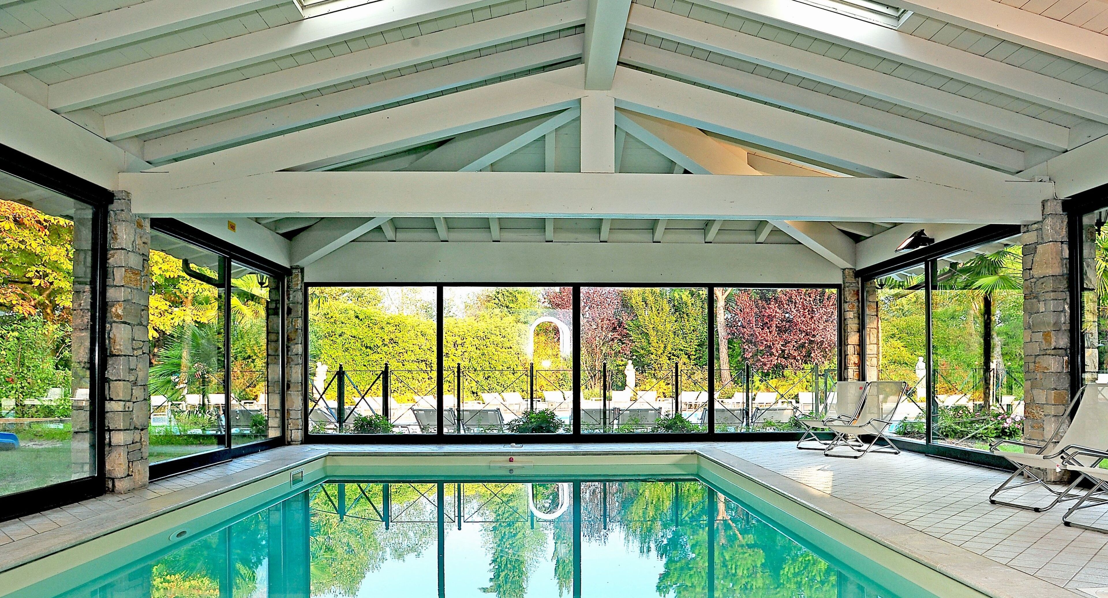 Indoor pool, outdoor pool, pool umbrellas, pool loungers