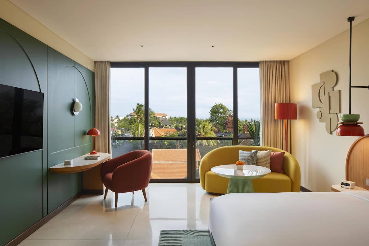 Room, 1 King Bed (Neighborhood View) | Minibar, in-room safe, desk, laptop workspace