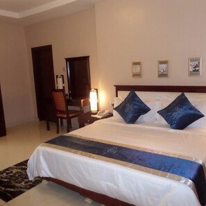 Desk, laptop workspace, blackout curtains, bed sheets