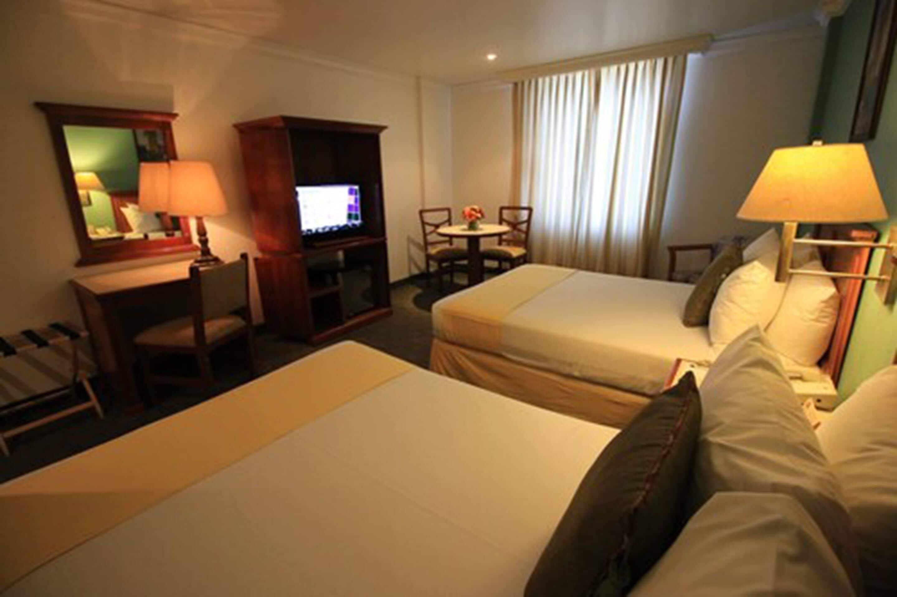 deluxe room, 2 double beds | 1 bedroom, in-room safe, individually decorated, individually furnished