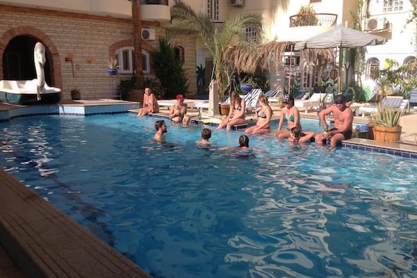 Outdoor pool, pool umbrellas, pool loungers