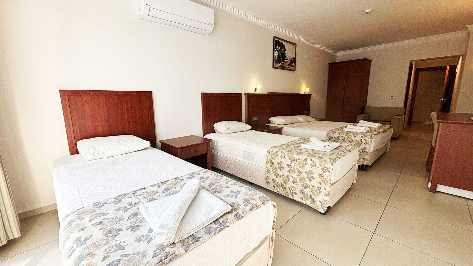 Deluxe Quadruple Room | Premium bedding, in-room safe, soundproofing, free WiFi