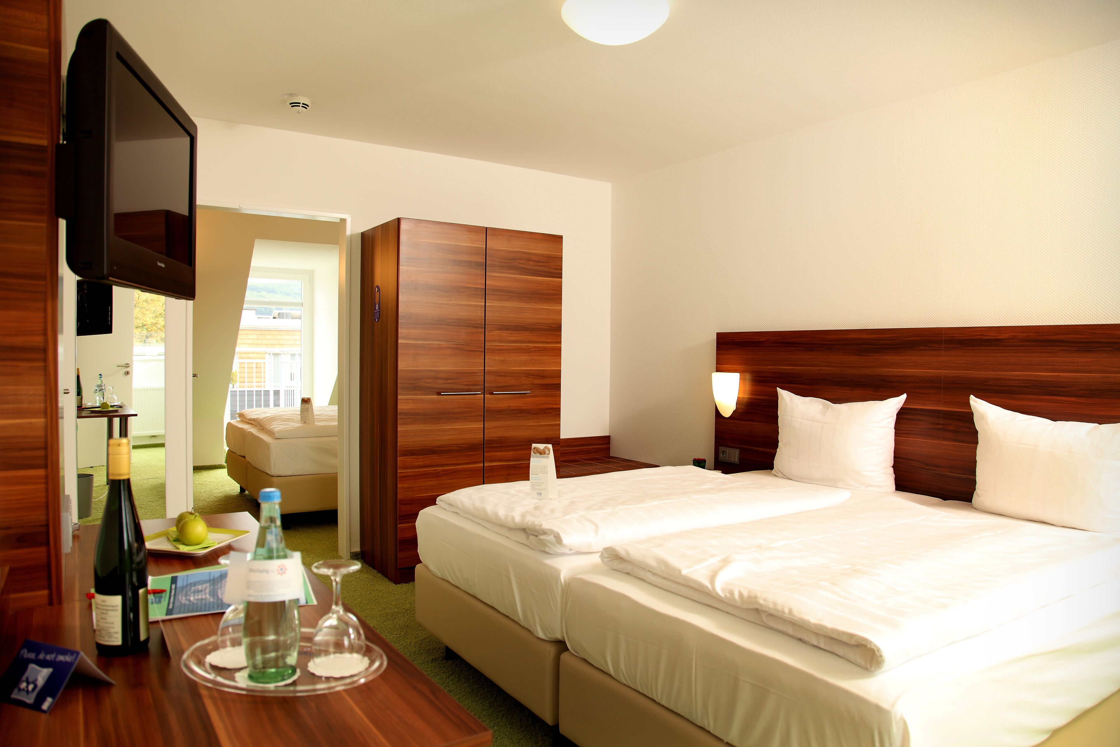 family room | hypo-allergenic bedding, desk, soundproofing, free cots/infant beds