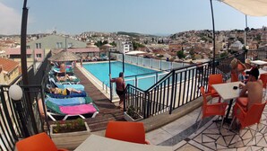A rooftop pool area with a view of the cityscape. - Surtel Hotel (Kusadasi)