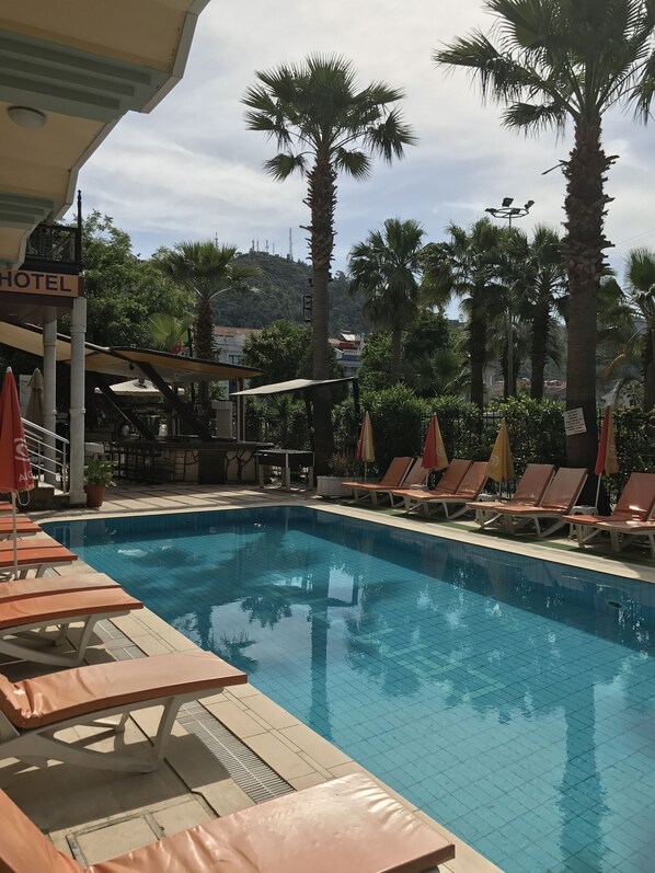 Outdoor pool, pool umbrellas, pool loungers