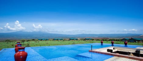 Outdoor pool, pool umbrellas, sun loungers