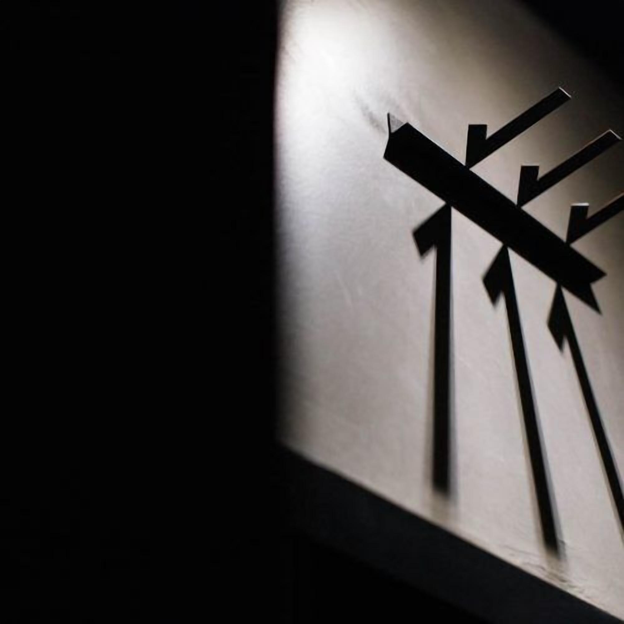 A wall with a geometric pattern of intersecting lines and shapes.