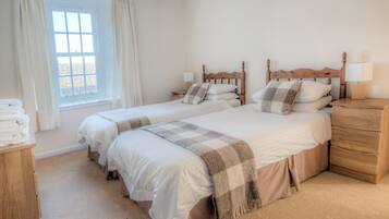 Basic House | Hypo-allergenic bedding, desk, laptop workspace, blackout curtains