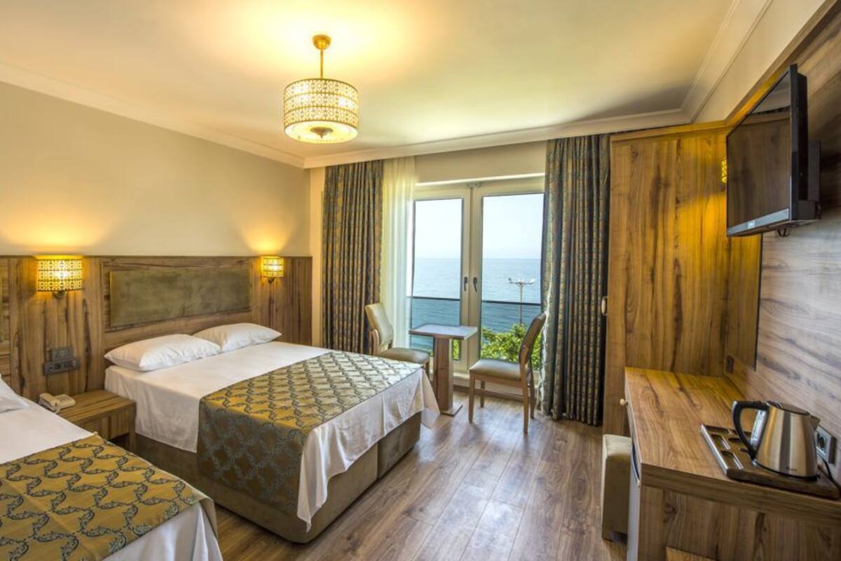 Standard Triple Room | Minibar, in-room safe, desk, soundproofing