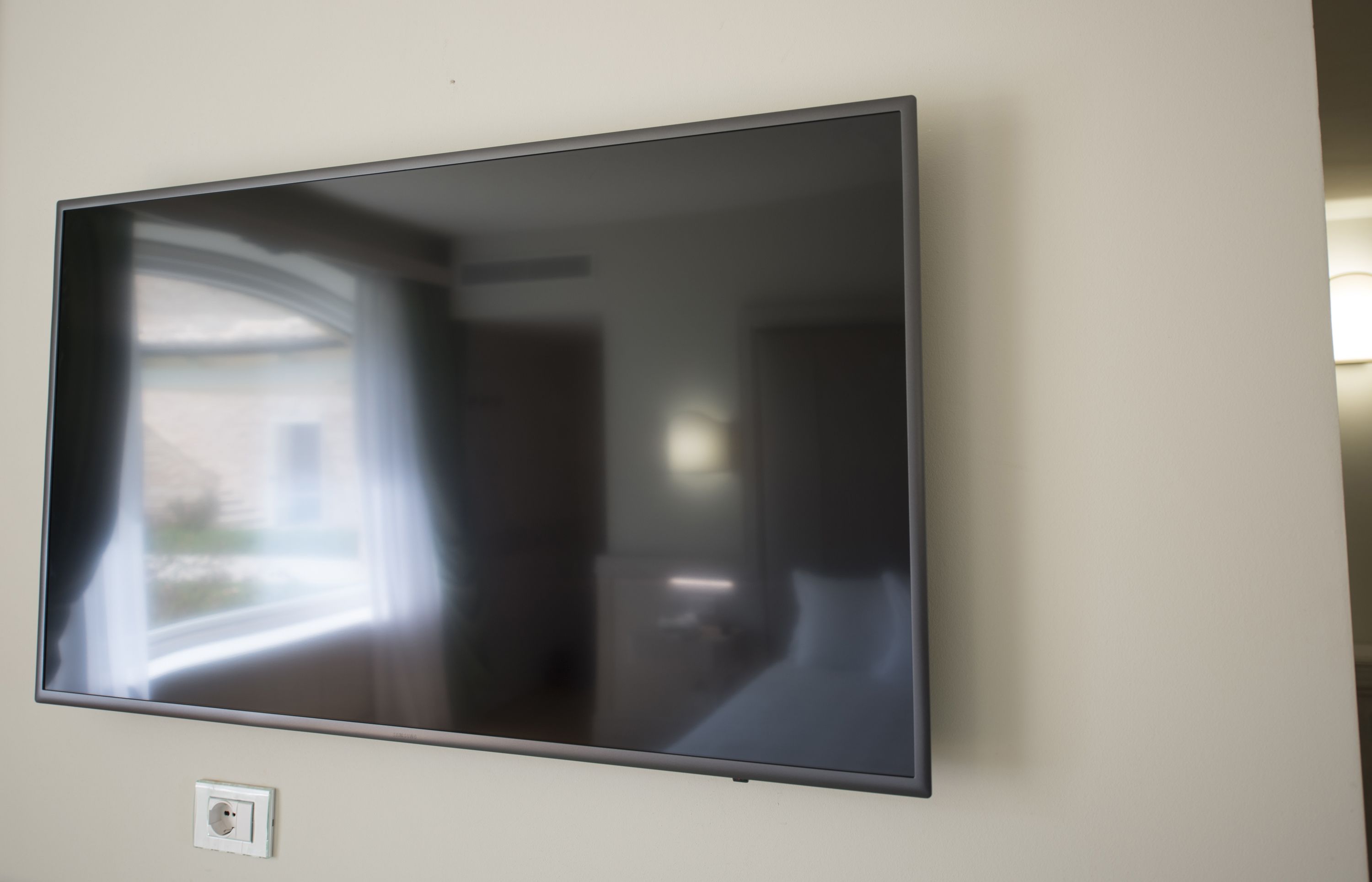 A flat-screen TV mounted on a wall.