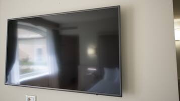 A flat-screen TV mounted on a wall.