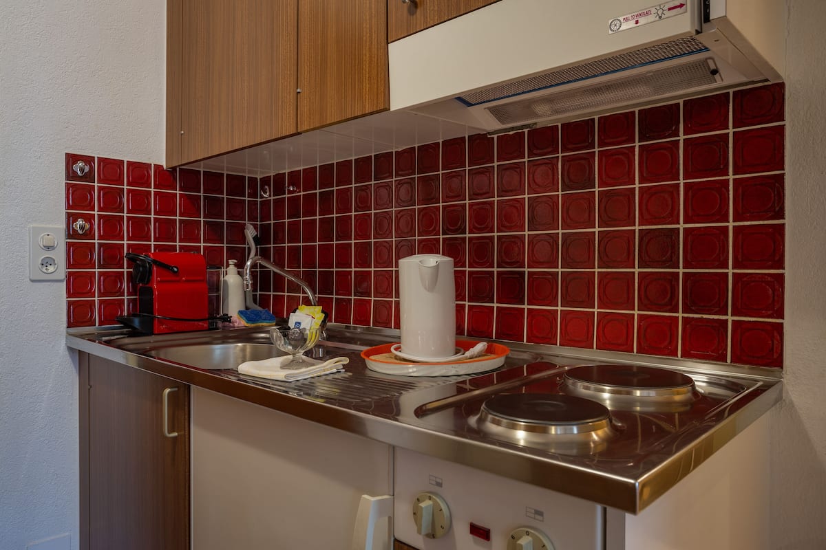 double room with matterhorn view | private kitchen | fridge, microwave, stovetop, espresso maker