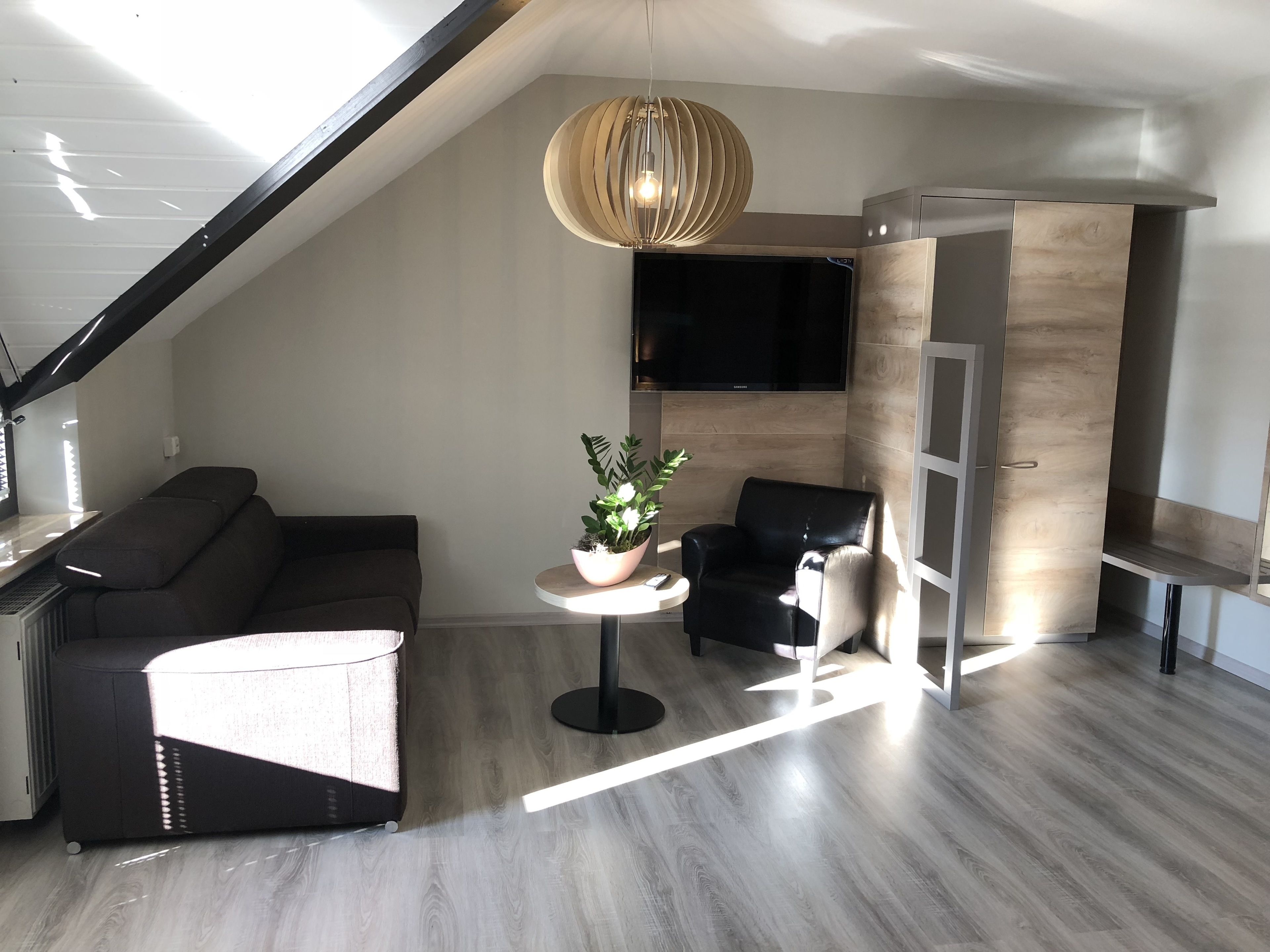 junior suite | living area | flat-screen tv