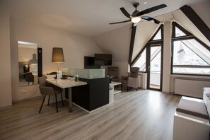 Deluxe Suite | Living area | Flat-screen TV