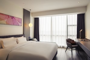 Premium bedding, down comforters, pillowtop beds, free minibar