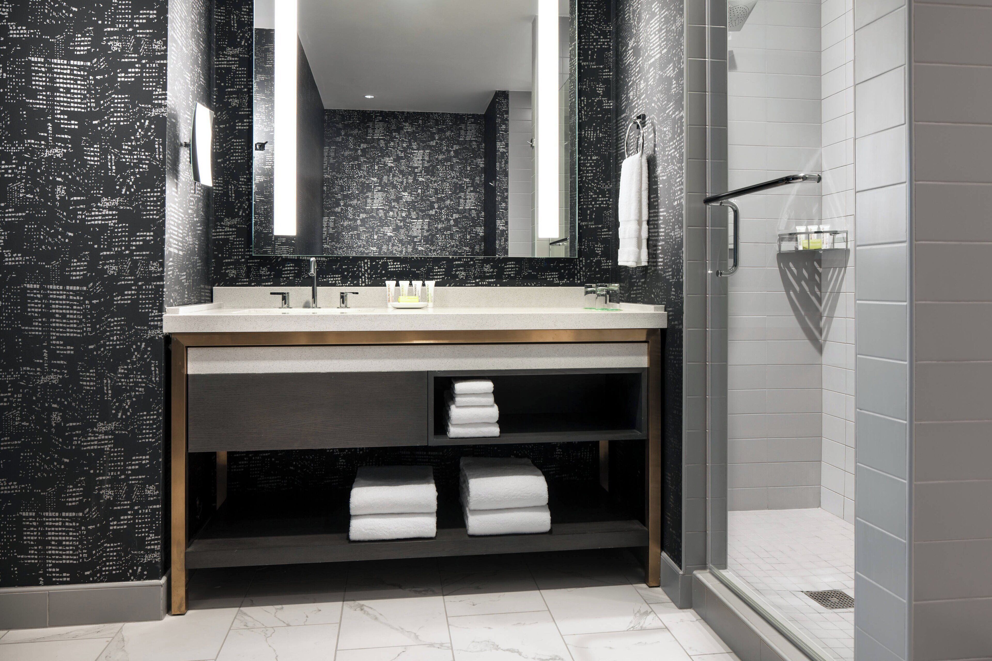 combined shower/bathtub, free toiletries, hair dryer, bathrobes