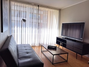 Apartment | Living area | 40-inch flat-screen TV with satellite channels, TV