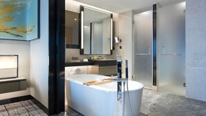 A modern bathroom with a freestanding bathtub, a large mirror, and a walk-in shower. - Crowne Plaza Shanghai Pujiang by IHG (Shanghai)