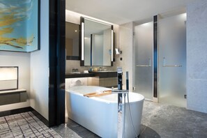 A modern bathroom with a freestanding bathtub, a large mirror, and a walk-in shower. - Crowne Plaza Shanghai Pujiang by IHG (Shanghai)